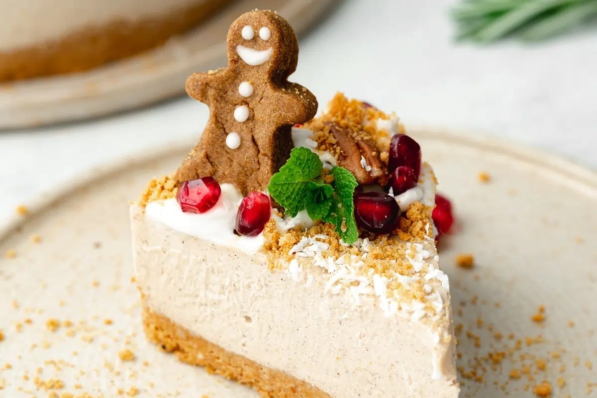 A delectable slice of gingerbread cheesecake on a festive plate.