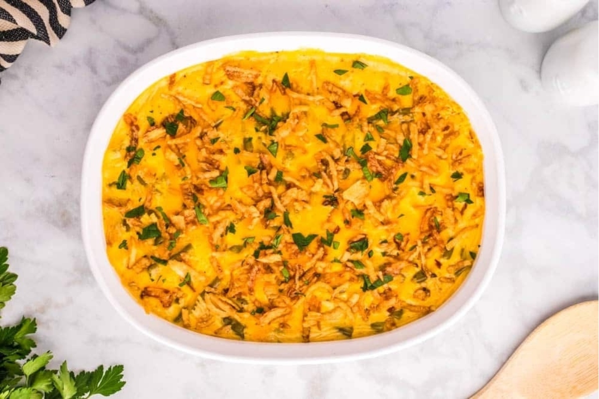 A make-ahead cheesy chicken enchilada casserole, perfect for holiday gatherings.