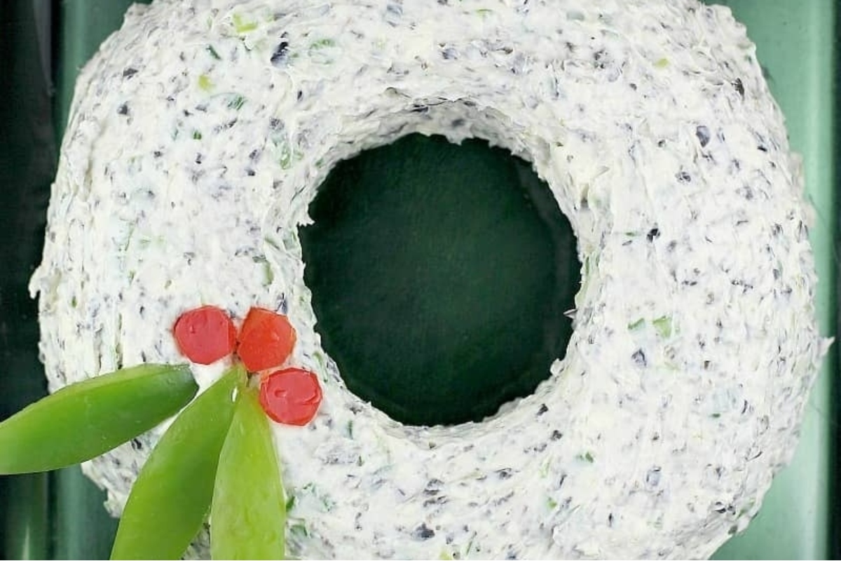 Make ahead holiday wreath made out of cheese and green onions.