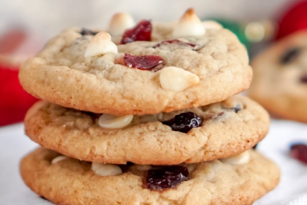 A stack of cookies with cranberries and white chocolate, perfect for cranberry snack recipes.