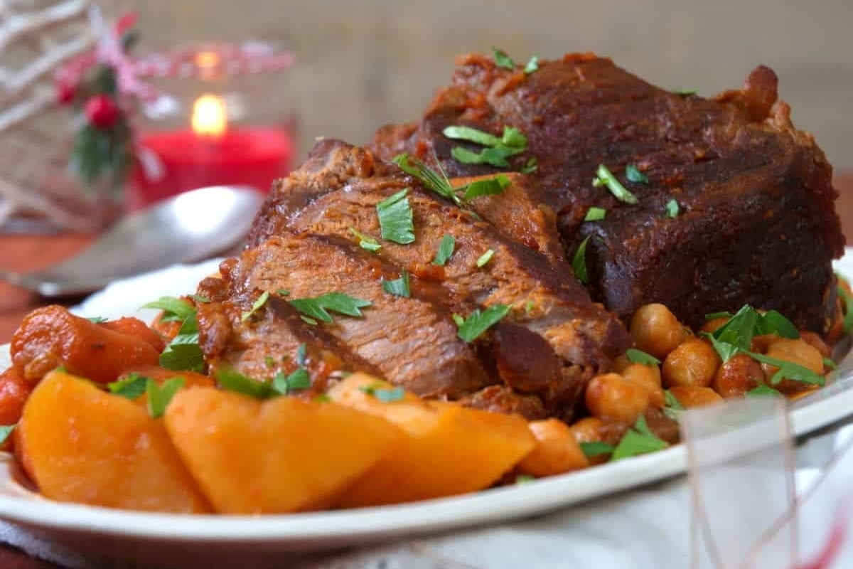 A slow cooker roast with juicy steak, tender potatoes, and hearty chickpeas - perfect for a delicious Christmas meal.