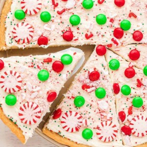 A slice taken from a sugar cookie pizza.