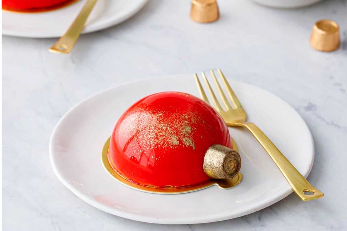         Description: A festive Christmas cake on a plate.