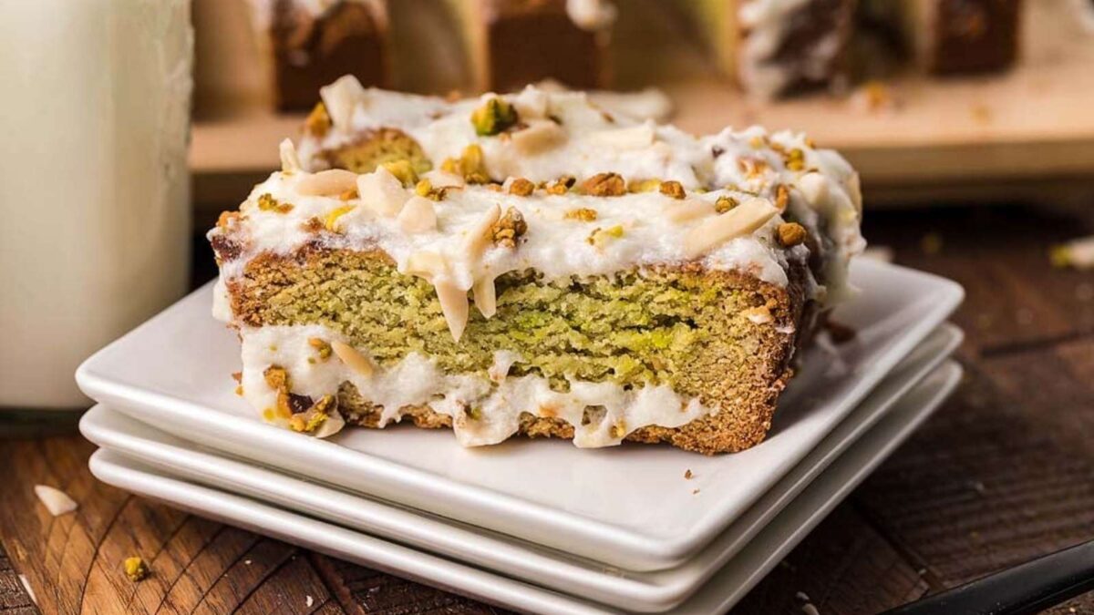 A slice of pistachio pistachio bread on a plate.