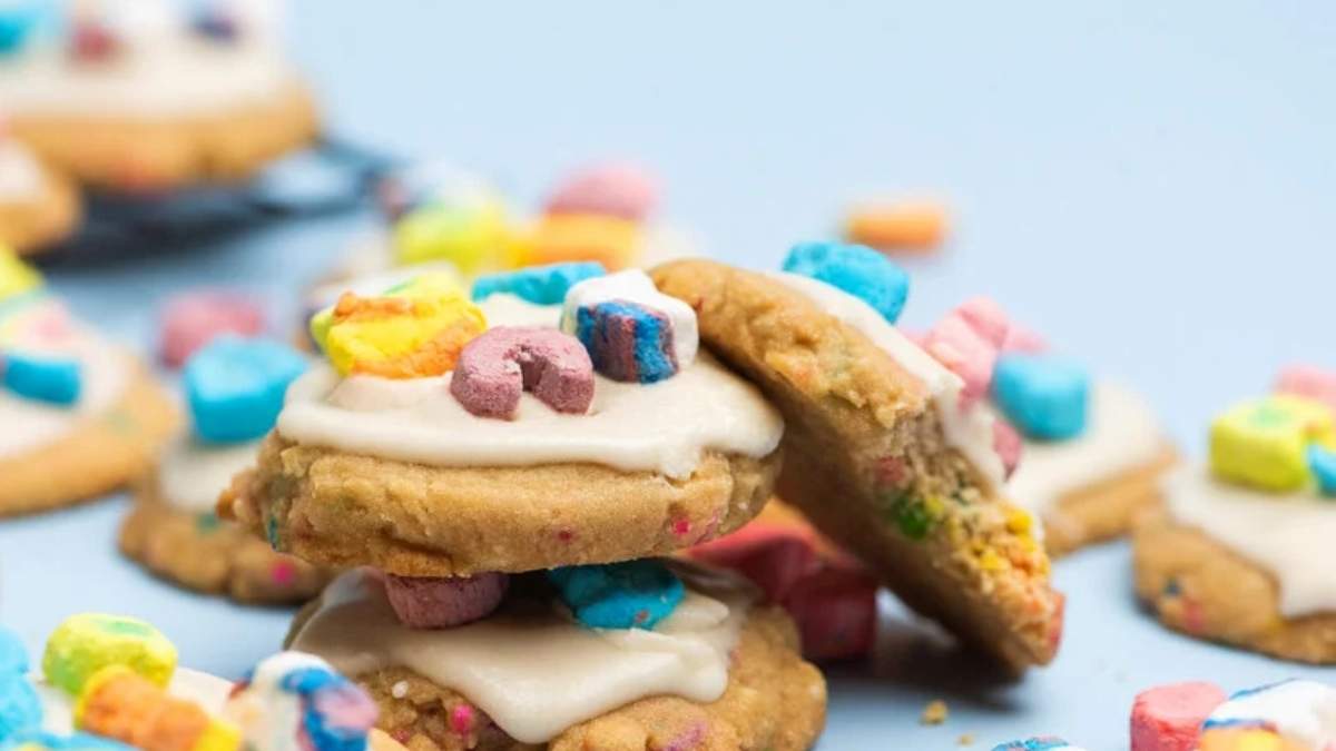 Frosted Lucky Charms cookies stacked on top of each other, made using delicious cookie recipes.