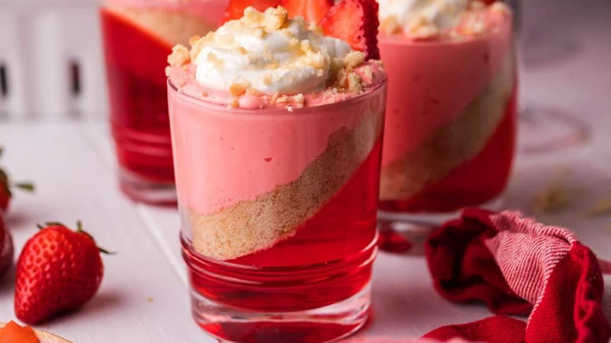 A pink no bake dessert with strawberries and whipped cream featured in a shared roundup.