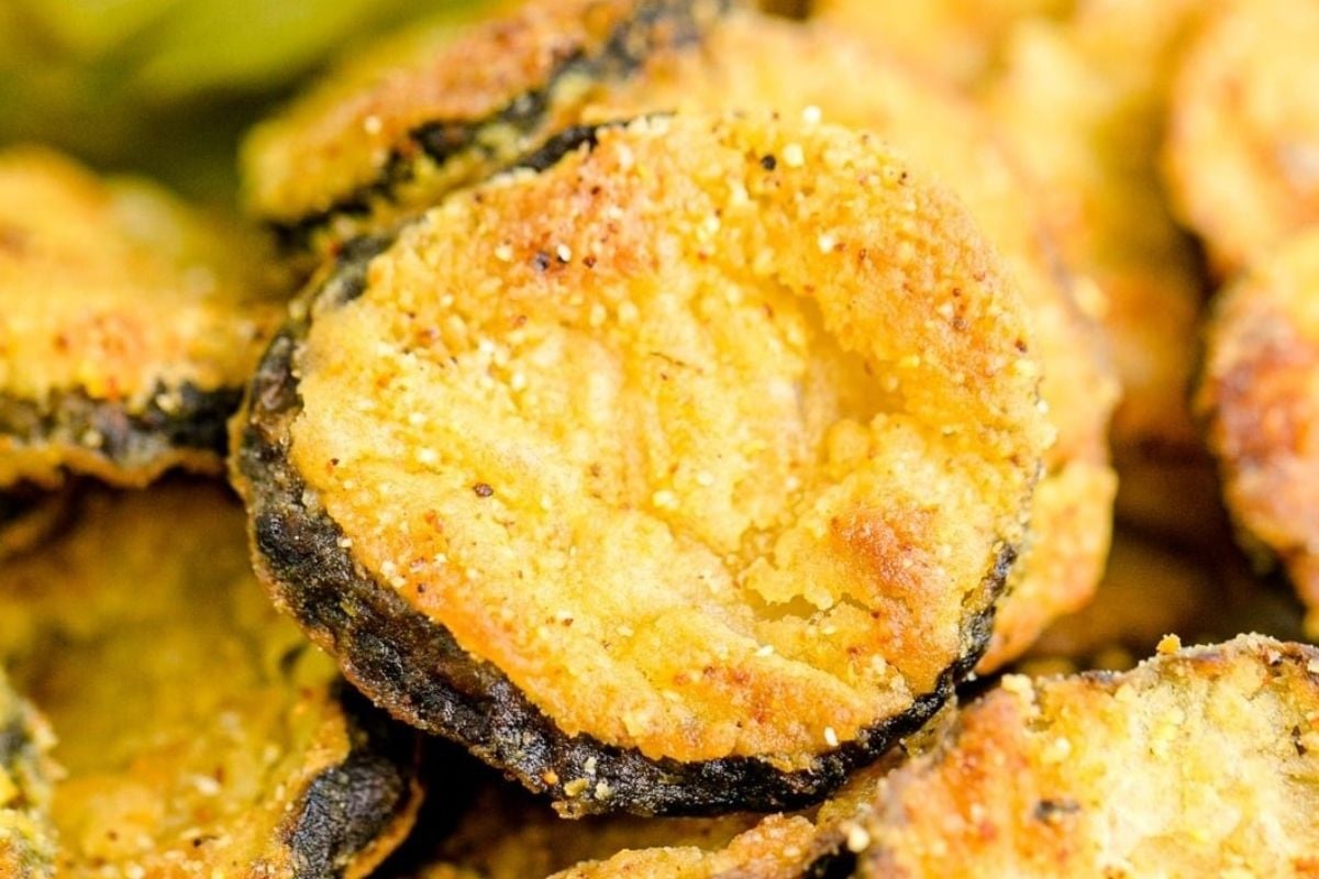 A pile of fried eggplant chips on a plate.