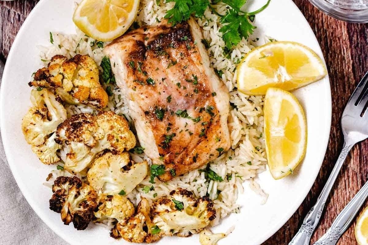 Wholesome salmon and cauliflower on a white plate.