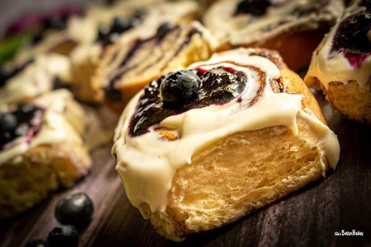 Blueberry cinnamon rolls with icing and blueberries are a delicious twist on traditional cinnamon roll recipes.