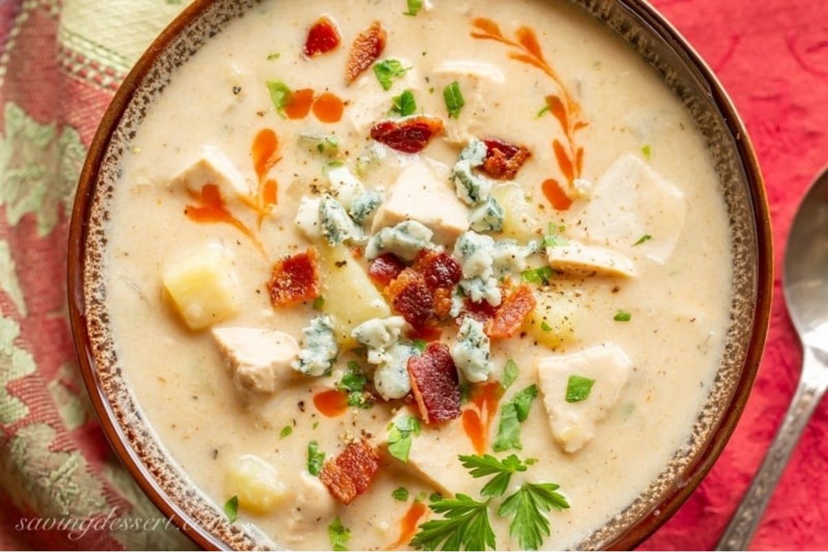 A flavorful bowl of chicken chowder with blue cheese and bacon, perfect for those looking for new chowder recipes to try.
