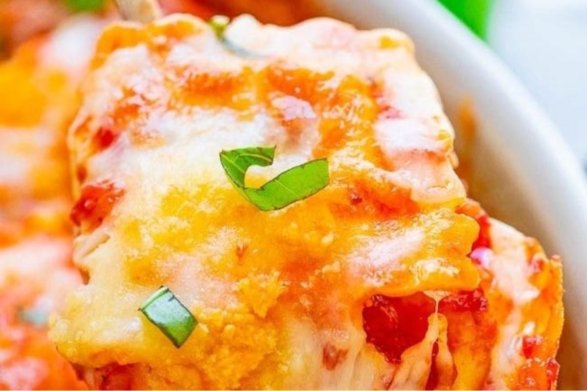 Mexican lasagna with a cheesy twist in a white bowl.