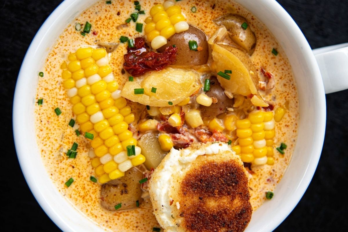 A delectable chowder recipe featuring corn and potatoes in a savory soup.