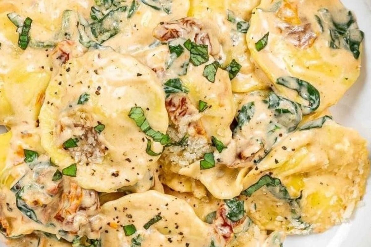 A plate of pasta with spinach and cheese, typically found in ravioli recipes.