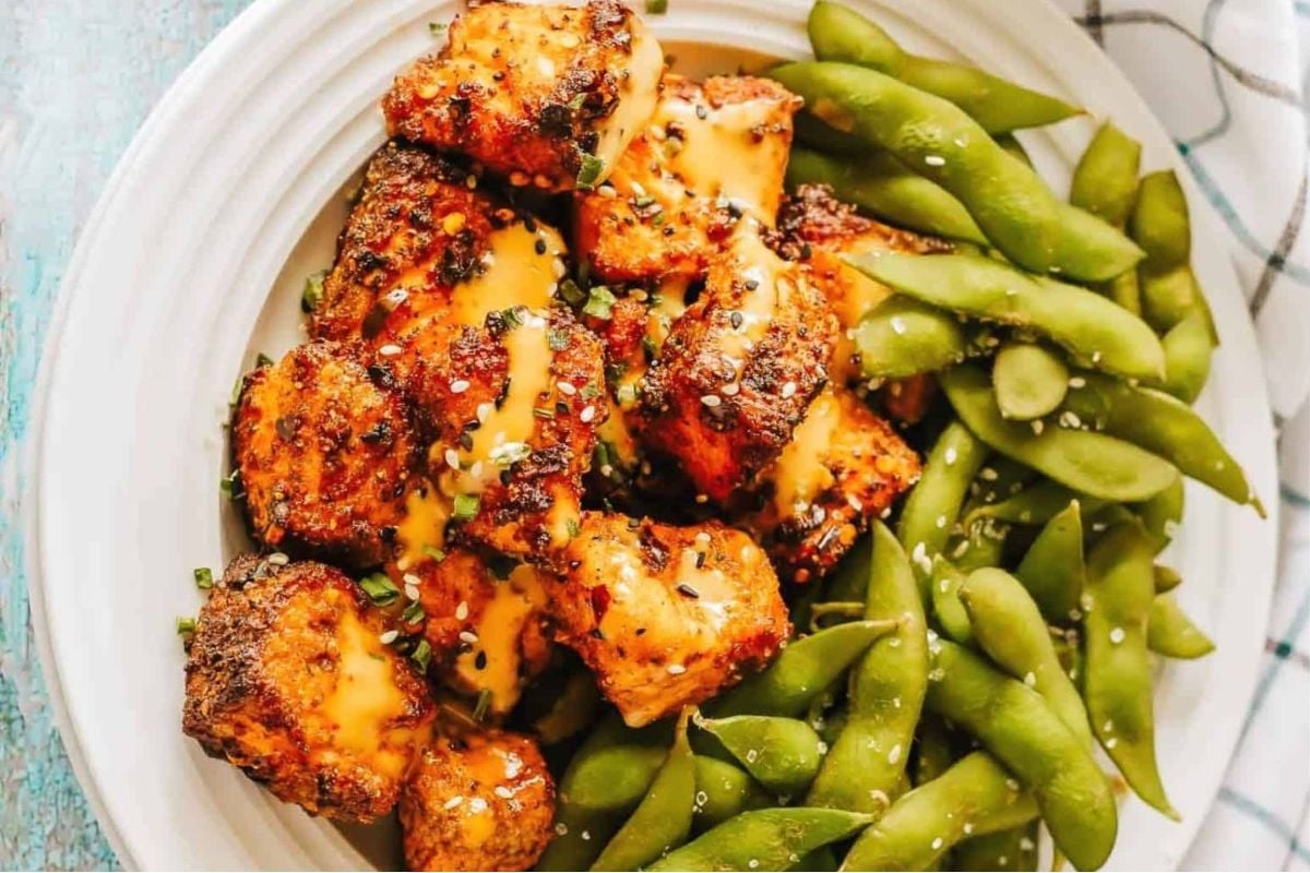 A wholesome plate with grilled chicken and green beans cooked in an air fryer.