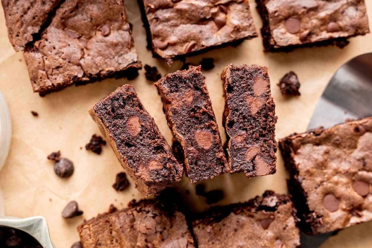         Chocolate brownies cut into squares on a wooden board, perfect for indulging in your favorite brownie recipes.