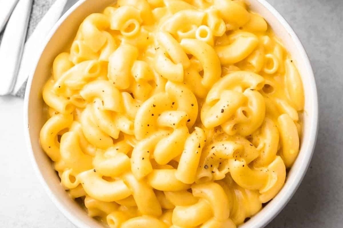Instant Pot macaroni and cheese served in a white bowl.