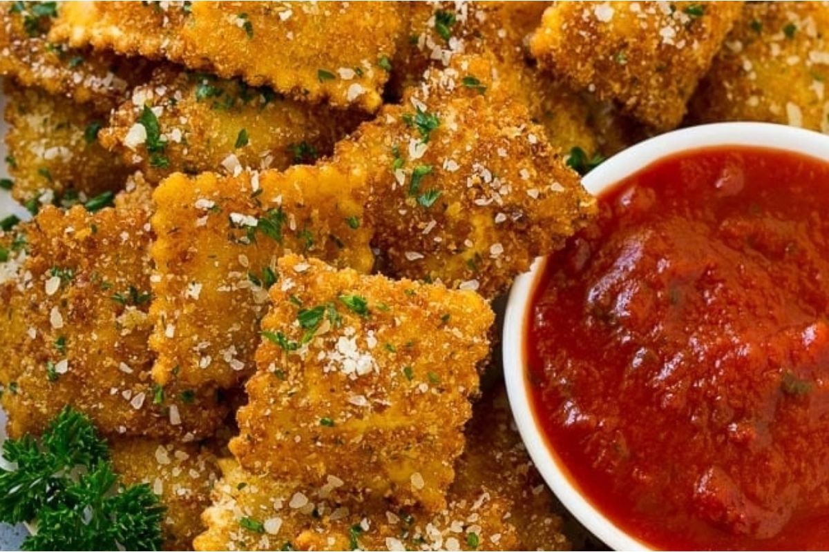 Delicious ravioli with tomato sauce on a plate.