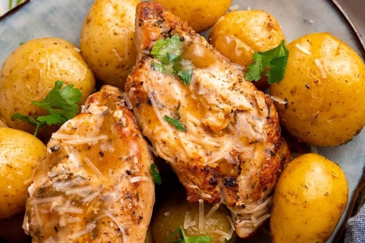 A mouthwatering dish of winter comfort food - tender chicken breasts and fluffy potatoes - beautifully plated.