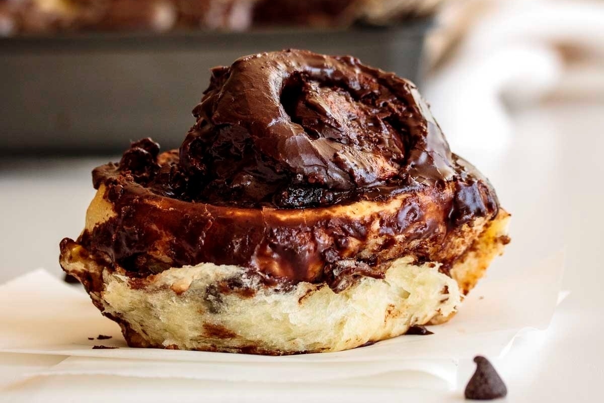 A mouthwatering cinnamon roll topped with rich chocolate icing.