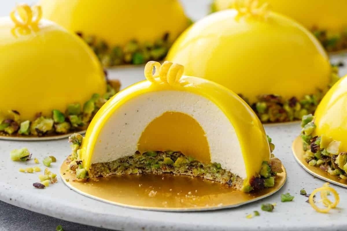 Indulge in these delectable lemon meringue tarts topped with crunchy pistachios for a refreshing twist on citrus recipes.