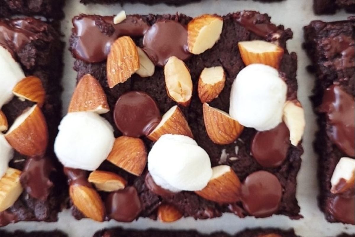 Brownies with marshmallows and almonds on top are a delectable twist to traditional brownie recipes.