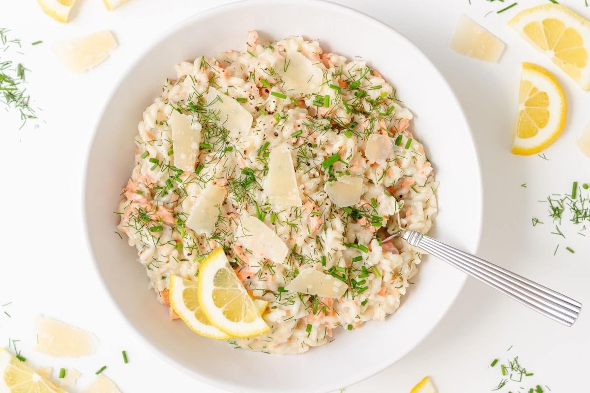 Winter Salmon Risotto: A comforting and delicious dish, this salmon risotto is expertly cooked using an Instant Pot. Served in a white bowl, it is beautifully garnished with fresh lemon slices