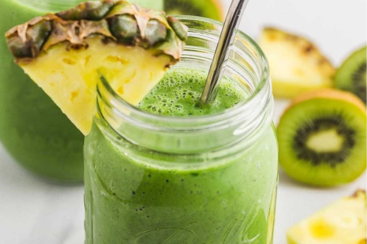 A green smoothie with kiwi, pineapple, and pinwheel recipes.