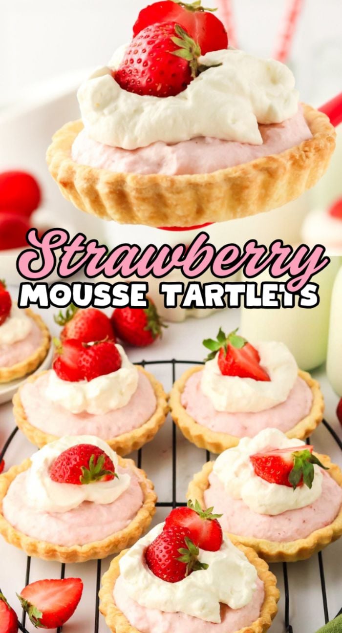 Strawberry Mousse Tartlets topped with whipped cream and fresh strawberries are beautifully displayed on a cooling rack, perfect for any dessert table.