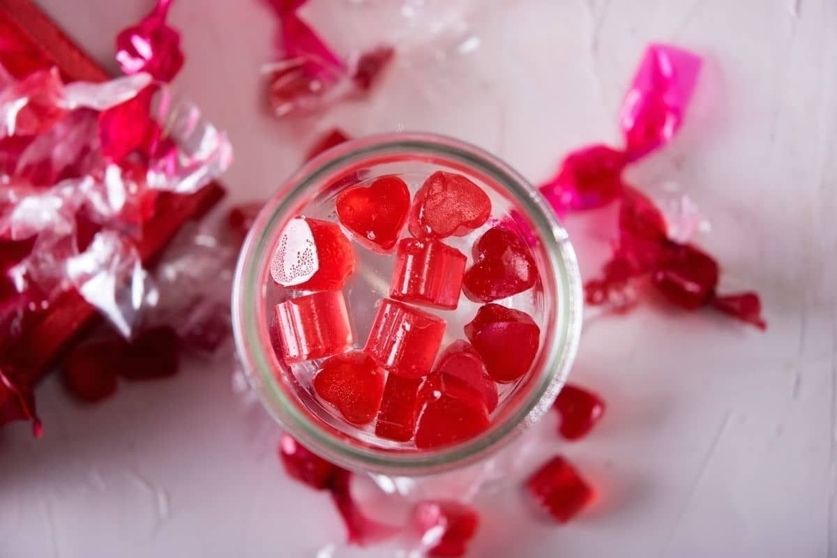 A jar of heart-shaped red candy.