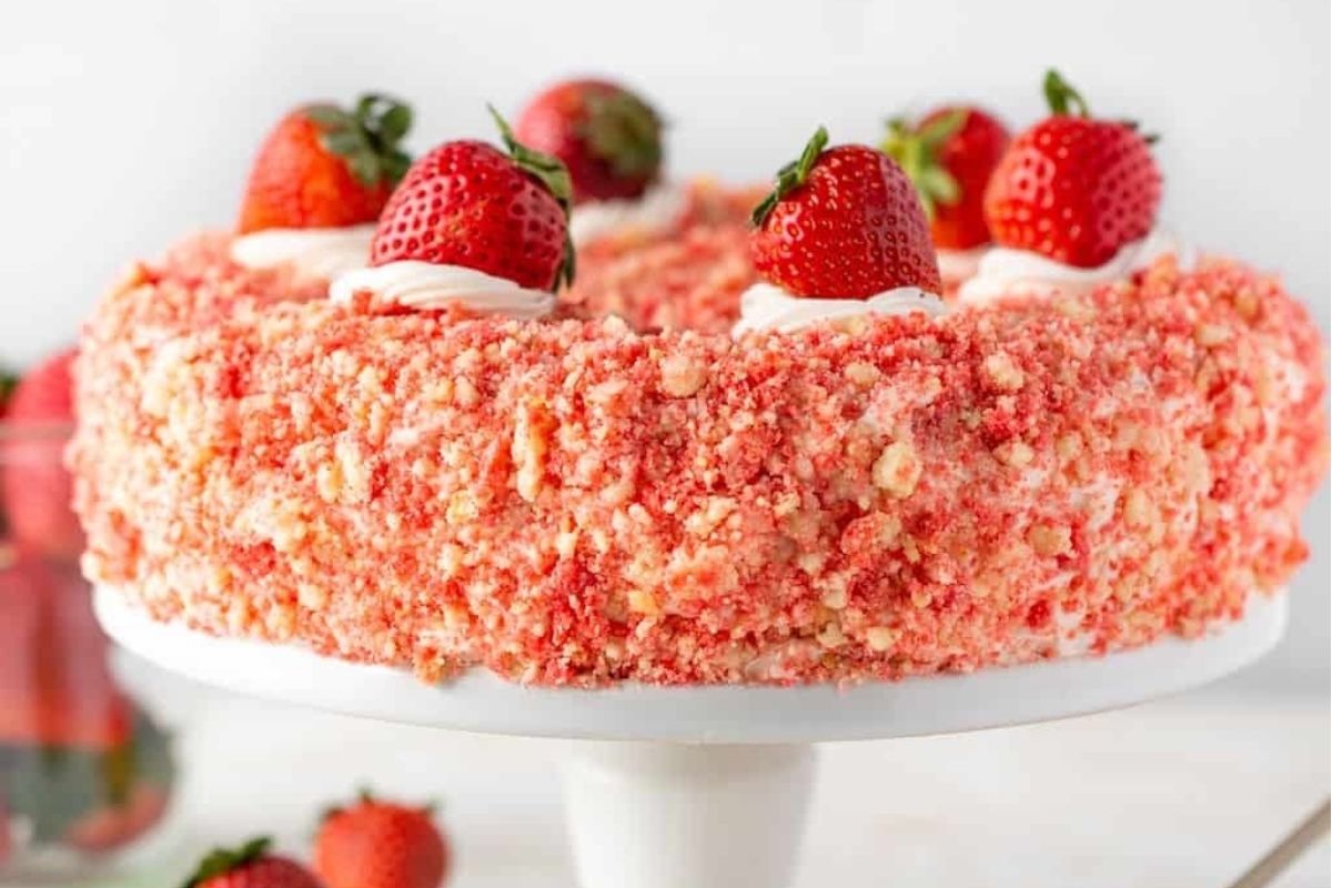 Valentine's dessert: Strawberry cake on a white cake stand.