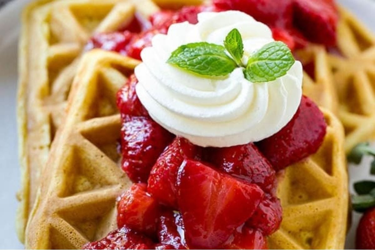 Delicious waffle recipes made even more delightful with fresh strawberries and fluffy whipped cream.