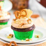 Chocolate pretzel cupcakes topped with pretzels and peanut butter frosting.