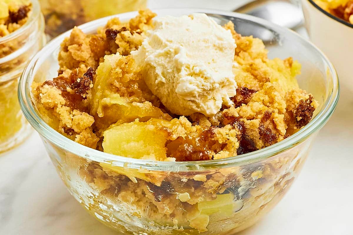 Apple crumble with ice cream, a delicious twist on traditional dump cakes.