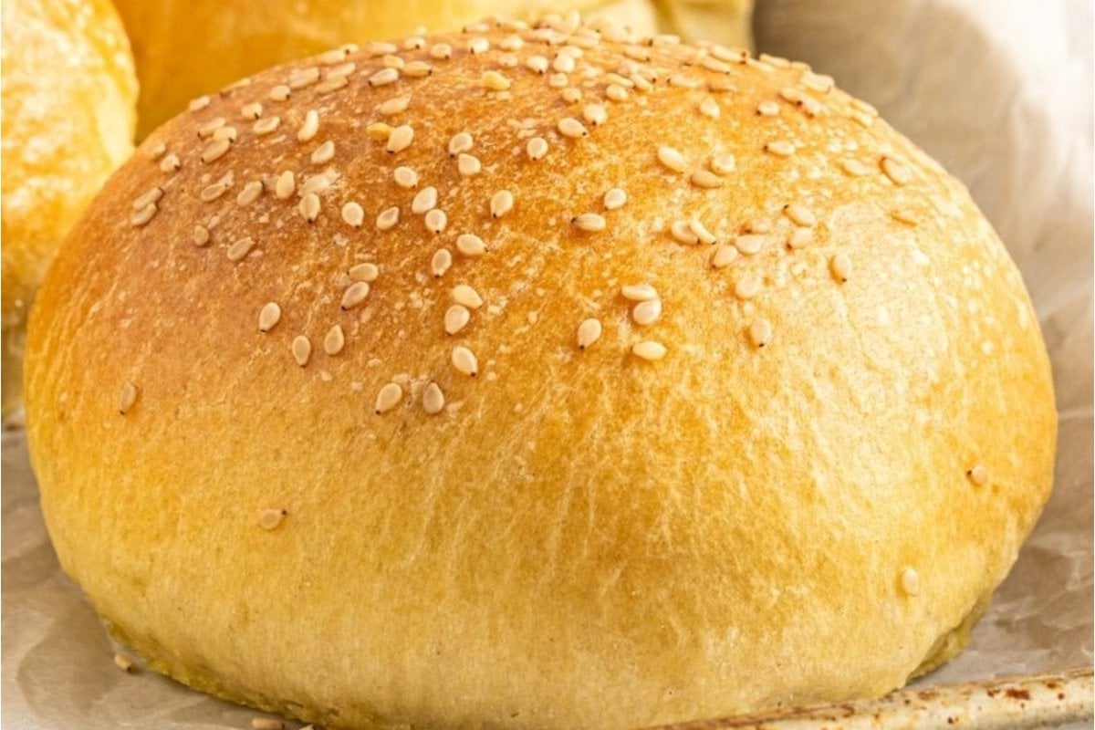 A loaf of bread with sesame seeds on it, perfect for various bread recipes.