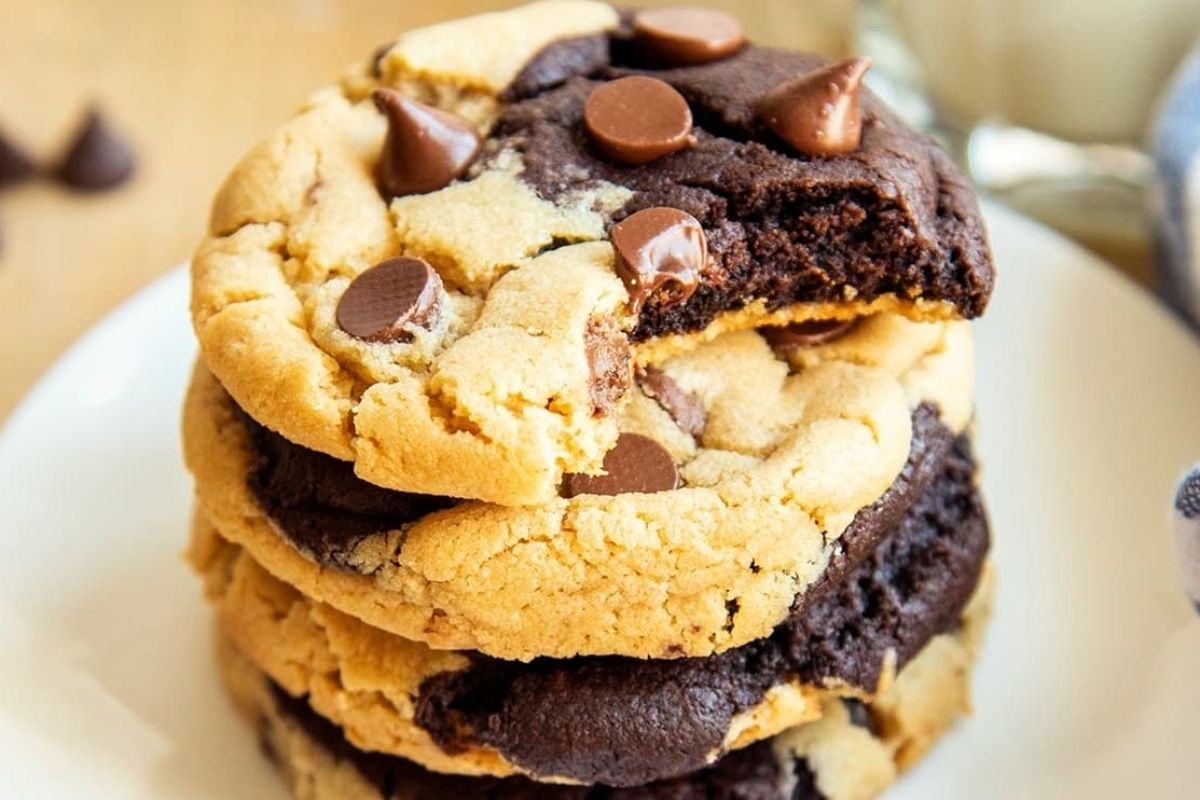 A stack of chocolate peanut butter chip cookies on a plate.
