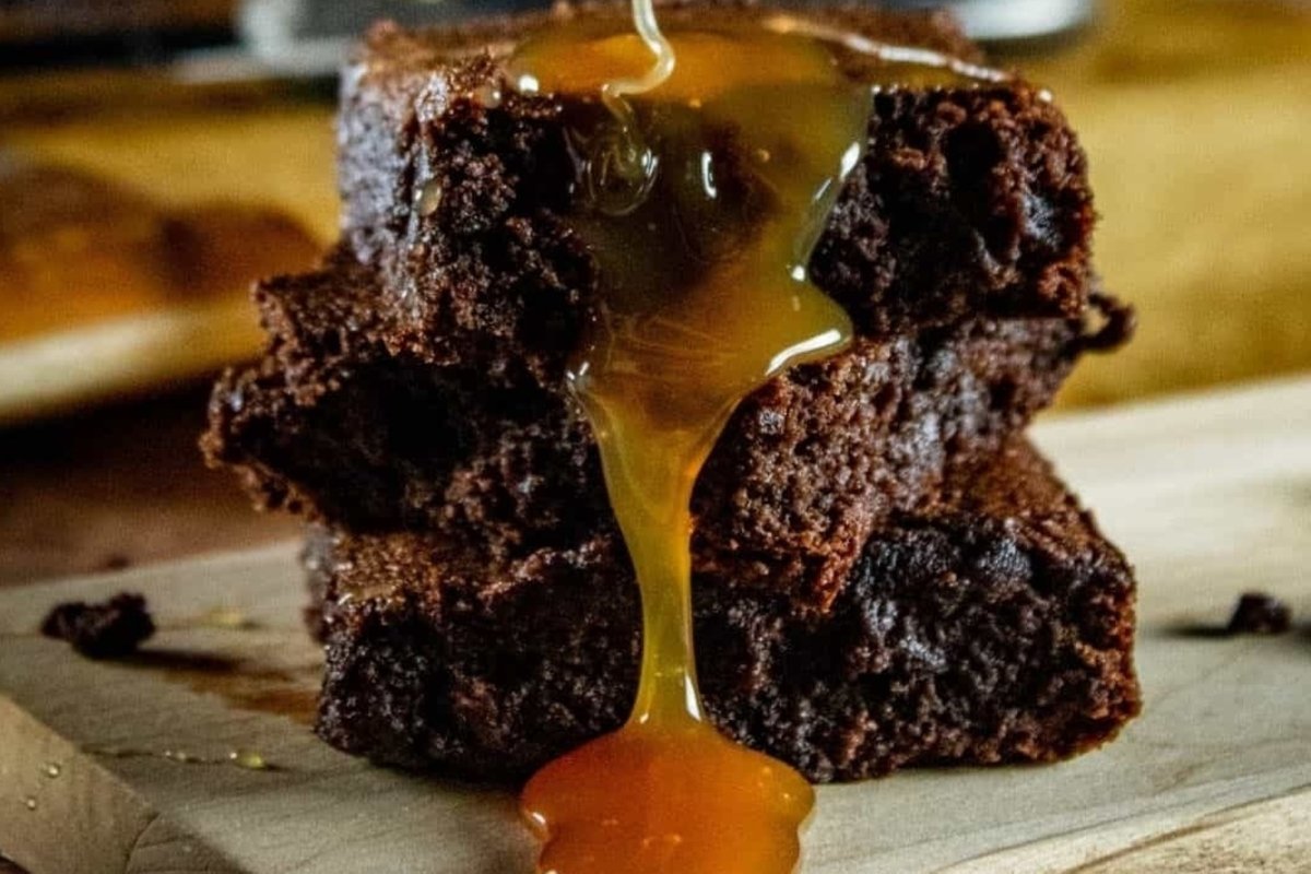 A stack of brownies with honey drizzled on top, ready to be enjoyed as a St. Patrick's treat.