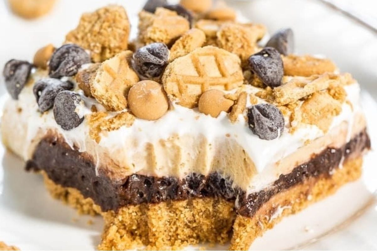 A piece of chocolate peanut butter ice cream pie on a plate.