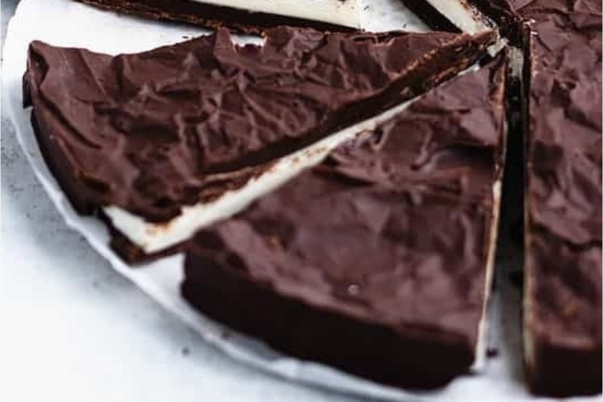 A slice of chocolate cake on a plate, perfect for those who love chocolate.