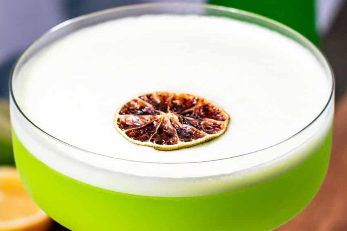 A green St Patrick's drink with a lime slice on top.