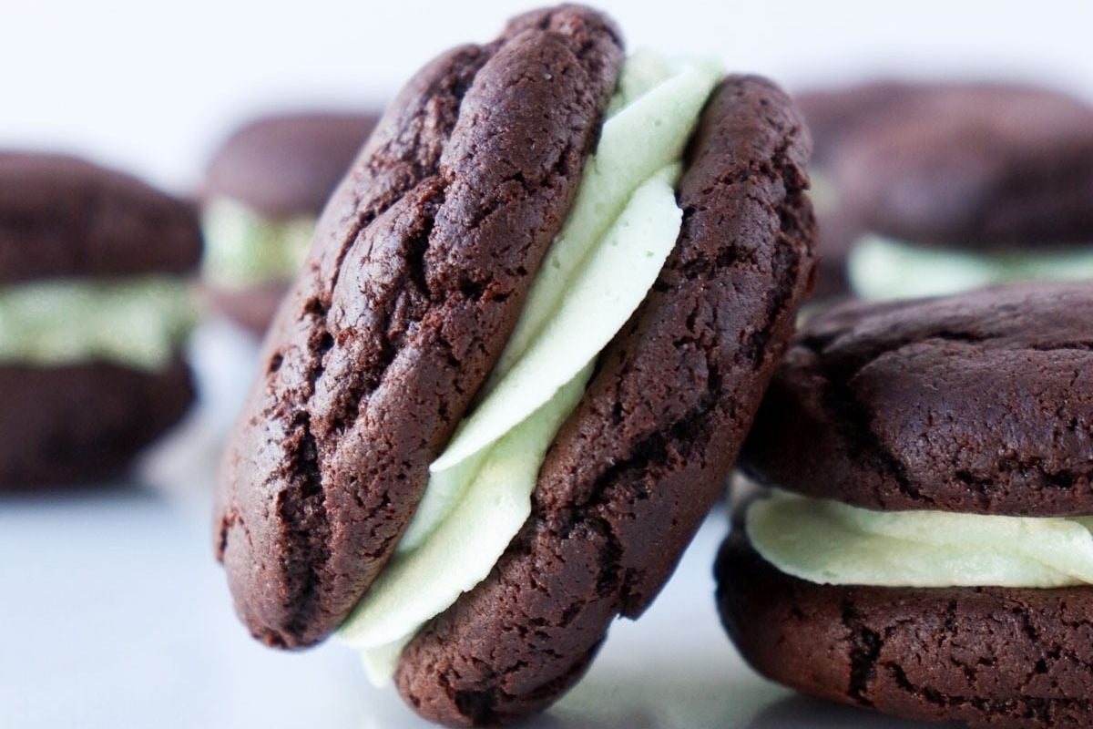 Indulge in these chocolate cookies topped with mint ice cream for a delicious treat.