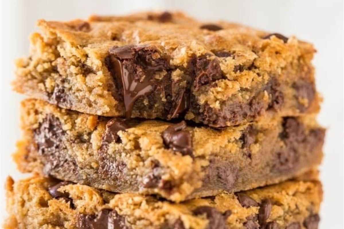 Three chocolate peanut butter chip cookie bars stacked on top of each other.