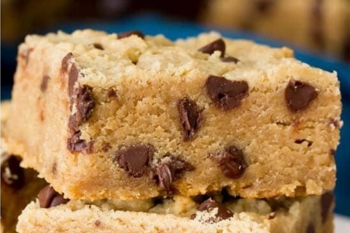 Chocolate peanut butter chip cookie bars stacked on top of each other.