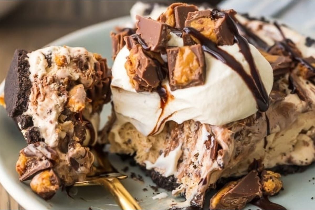 A slice of chocolate peanut butter ice cream pie on a plate.