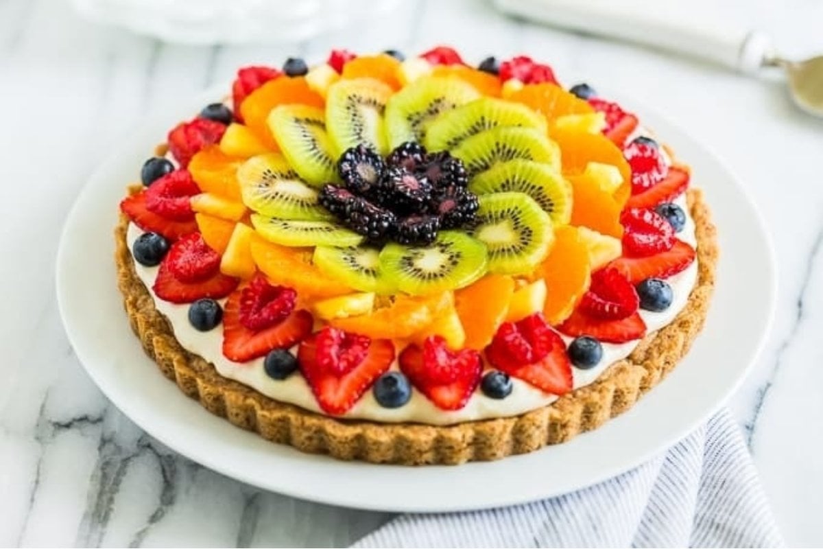 A colorful fruit pie on a plate.