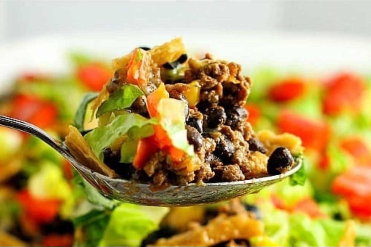 Mexican taco-flavored salad on a spoon.