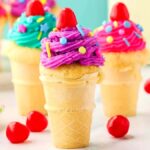 Cupcake ice cream cones with colorful sprinkles and candy.