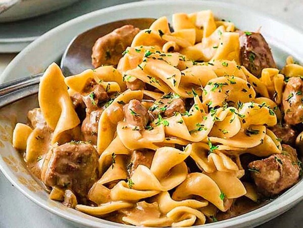 Beef and egg noodles in a bowl.