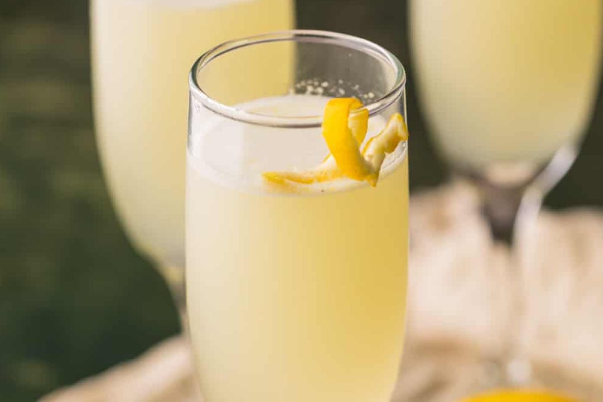 A glass of Easter lemonade garnished with a lemon twist.