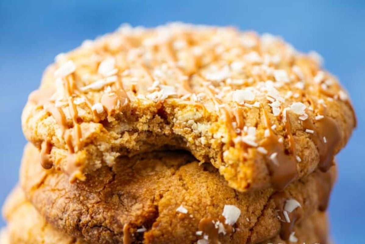 Stack of Easter cookies with caramel drizzle and sprinkled with coarse sugar.