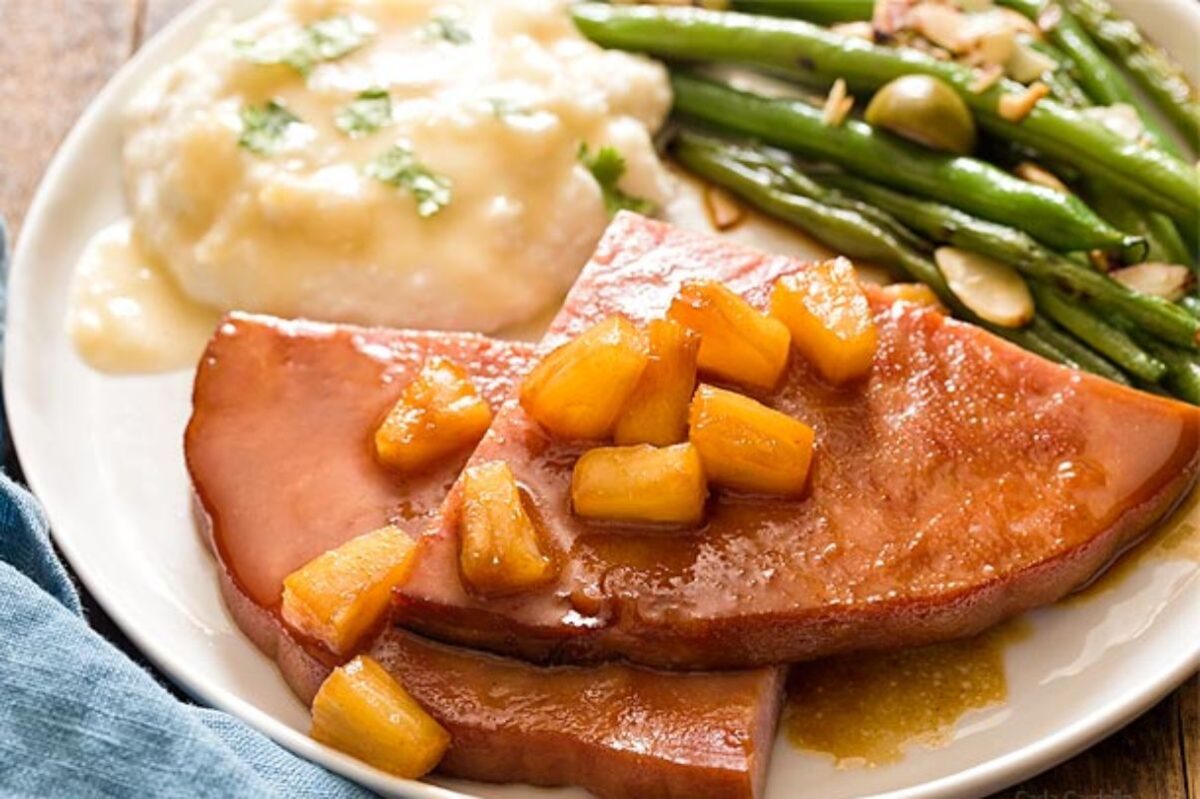 Easter dinner: Sliced ham with pineapple topping, served with mashed potatoes and green beans.